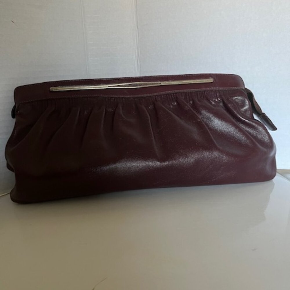 Phillippe east west vintage leather clutch.